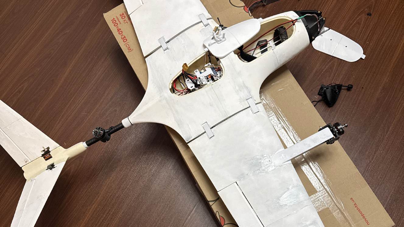 Flightory Stallion VTOL during assembly, with its electronics bay open and tilt-motor arms visible
